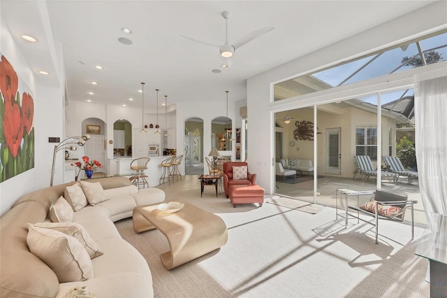 7214 Marlow Pl, University Park, FL 34201 - carpeted living area featuring arched walkways, recessed lighting, and a ceiling fan