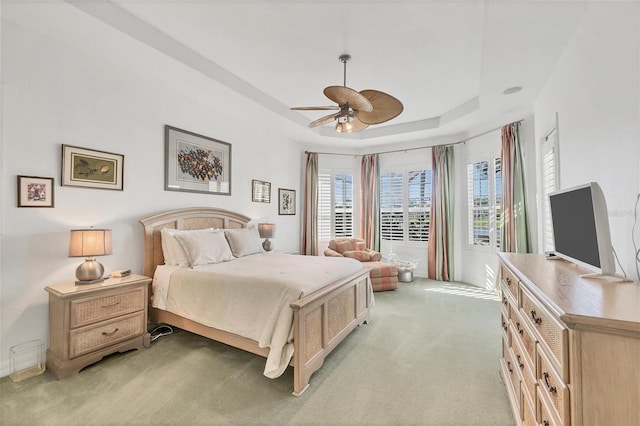 7214 Marlow Pl, University Park, FL 34201 - bedroom featuring light carpet, a raised ceiling, and a ceiling fan