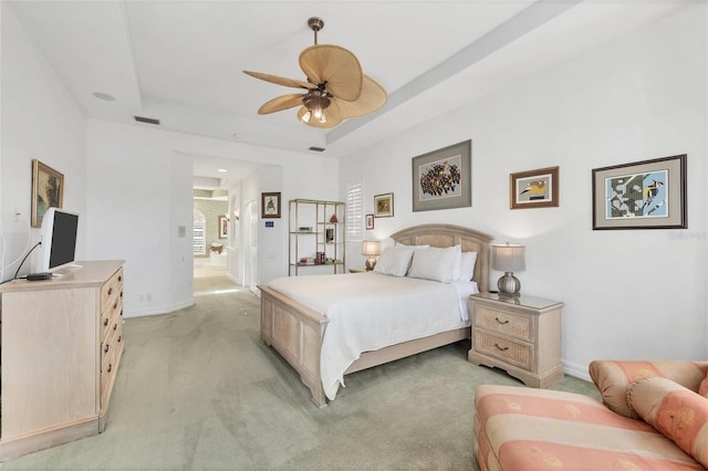 7214 Marlow Pl, University Park, FL 34201 - bedroom with a tray ceiling, light colored carpet, and a ceiling fan