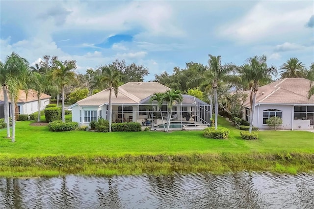 7214 Marlow Pl, University Park, FL 34201 - back of property with a water view, a tile roof, a yard, and stucco siding