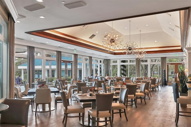 7214 Marlow Pl, University Park, FL 34201 - dining space featuring a chandelier, a raised ceiling, healthy amount of natural light, a towering ceiling, and recessed lighting