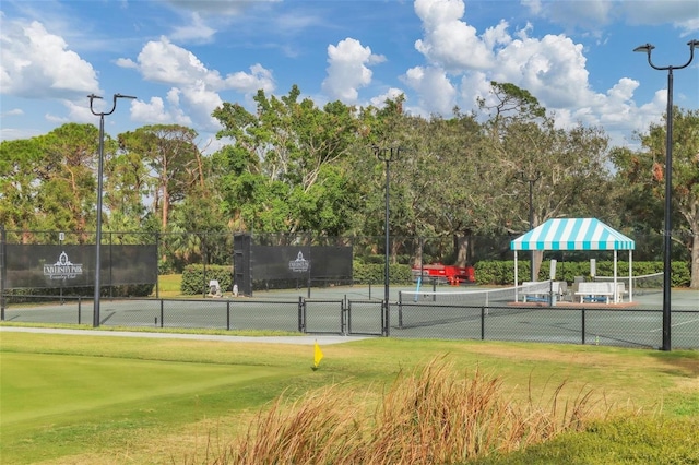 7214 Marlow Pl, University Park, FL 34201 - view of tennis court featuring view of scattered trees and a gate