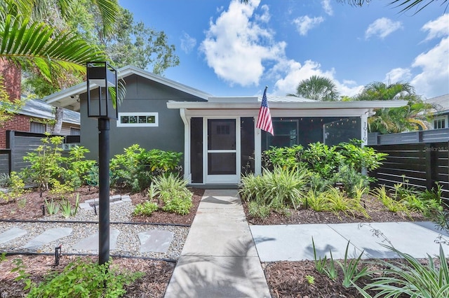 1919 Laurel St, Sarasota, FL 34236 - view of front facade with a sunroom and stucco siding