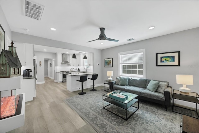 1919 Laurel St, Sarasota, FL 34236 - living room with ceiling fan, light wood-type flooring, and recessed lighting