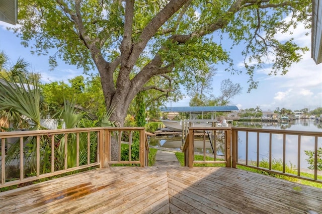 2002 8th St W, Palmetto, FL 34221 - deck featuring a water view, boat lift, and a boat dock