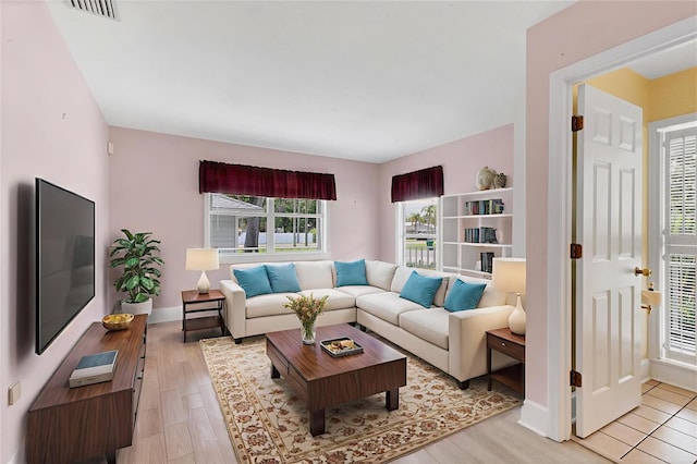 2002 8th St W, Palmetto, FL 34221 - living area with light wood-style floors