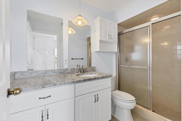 2002 8th St W, Palmetto, FL 34221 - bathroom with vanity, a shower stall, and toilet