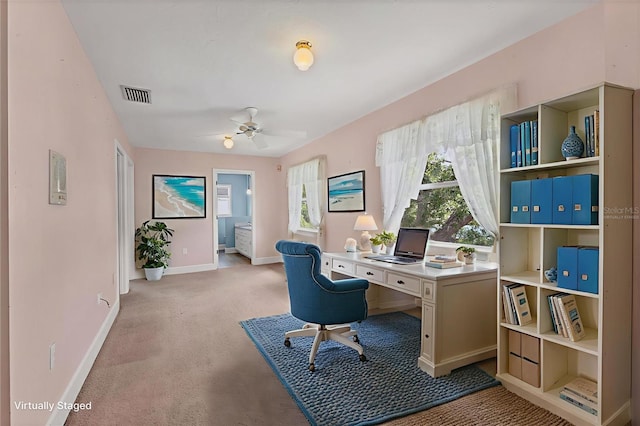 2002 8th St W, Palmetto, FL 34221 - office area with light colored carpet, baseboards, and ceiling fan