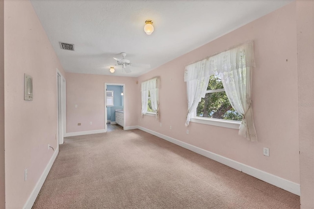 2002 8th St W, Palmetto, FL 34221 - carpeted empty room with baseboards and a ceiling fan