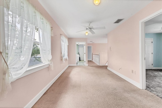 2002 8th St W, Palmetto, FL 34221 - unfurnished living room featuring carpet, ceiling fan, and baseboards