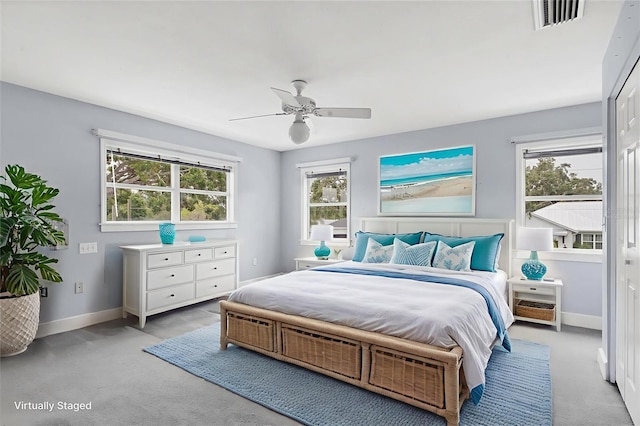 2002 8th St W, Palmetto, FL 34221 - carpeted bedroom with baseboards and a ceiling fan