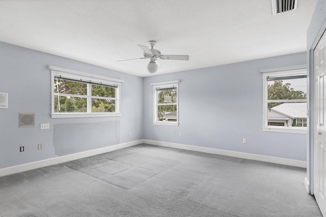 2002 8th St W, Palmetto, FL 34221 - spare room featuring carpet flooring, baseboards, and ceiling fan