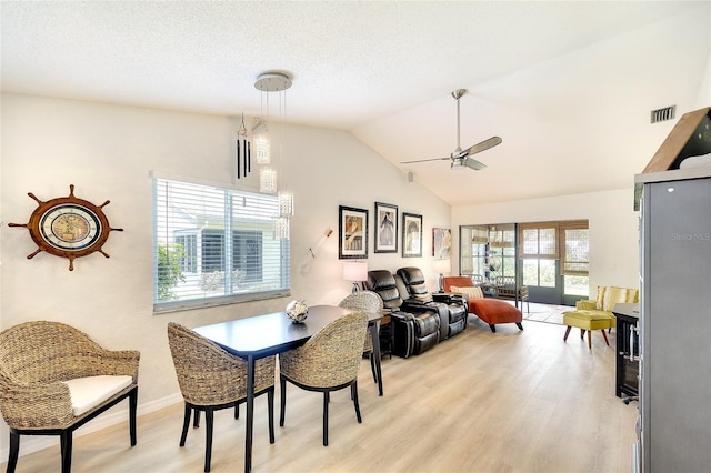 6024 28th St W, Bradenton, FL 34207 - dining area with a ceiling fan, light wood-type flooring, and high vaulted ceiling