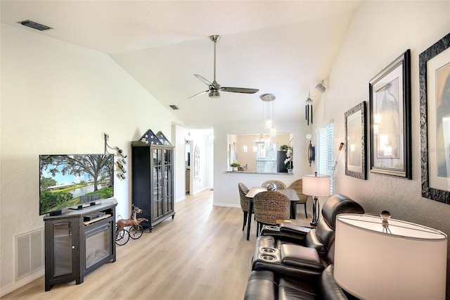 6024 28th St W, Bradenton, FL 34207 - living area featuring a ceiling fan, light wood-style flooring, and vaulted ceiling