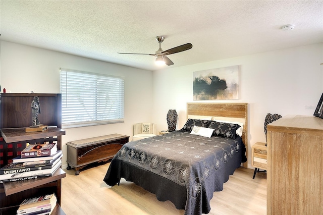 6024 28th St W, Bradenton, FL 34207 - bedroom featuring wood finished floors, a textured ceiling, and a ceiling fan