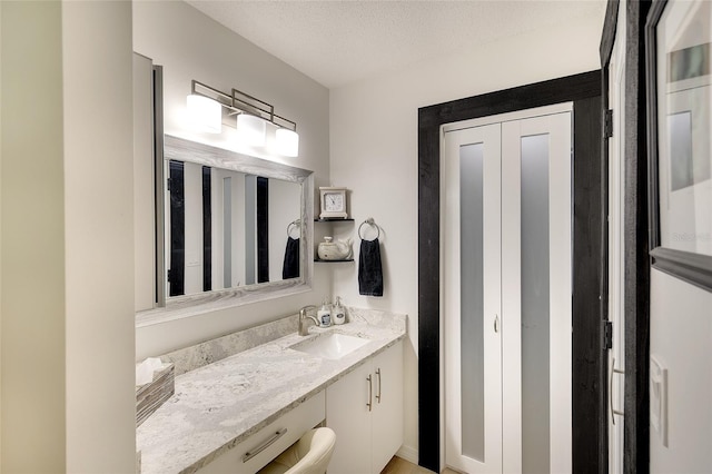 6024 28th St W, Bradenton, FL 34207 - bathroom with vanity and a textured ceiling