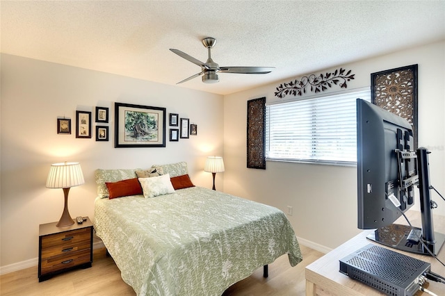 6024 28th St W, Bradenton, FL 34207 - bedroom featuring wood finished floors, a textured ceiling, and a ceiling fan