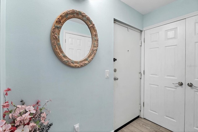 2740 Orchid Oaks Dr Unit 304, Sarasota, FL 34239 - entryway with light wood-style flooring