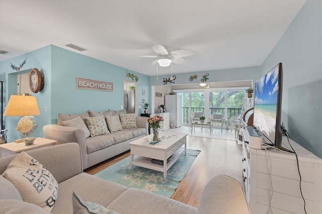 2740 Orchid Oaks Dr Unit 304, Sarasota, FL 34239 - living room featuring wood finished floors and a ceiling fan