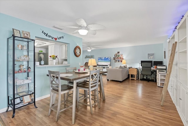 2740 Orchid Oaks Dr Unit 304, Sarasota, FL 34239 - dining room with light wood-style flooring, a ceiling fan, and an office area
