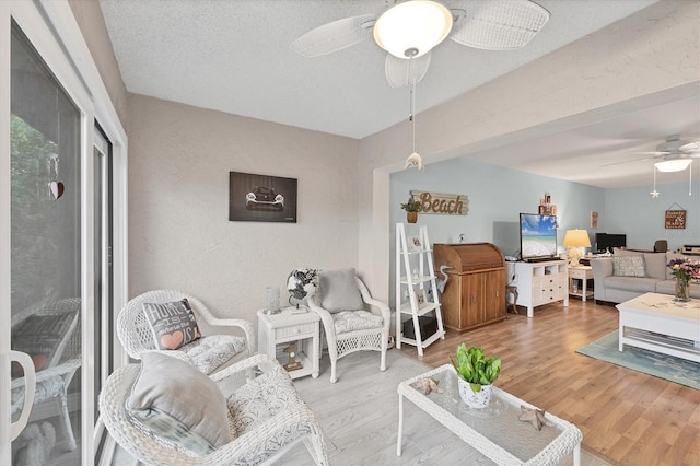 2740 Orchid Oaks Dr Unit 304, Sarasota, FL 34239 - living area featuring ceiling fan and wood finished floors