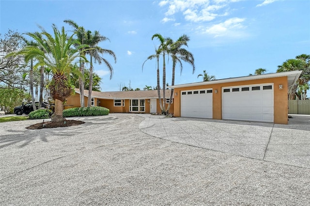 1203 Lyric Ln, Sarasota, FL 34242 - view of front of property with concrete driveway, a garage, and stucco siding