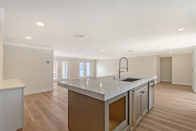 1203 Lyric Ln, Sarasota, FL 34242 - kitchen featuring light wood-style flooring, ornamental molding, light countertops, recessed lighting, and open floor plan