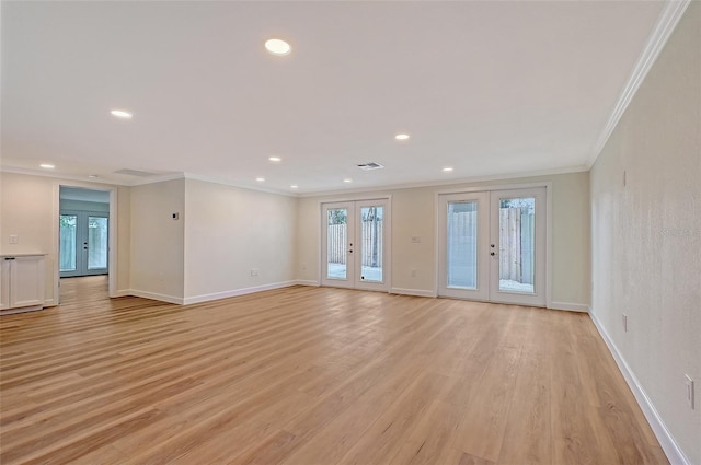 1203 Lyric Ln, Sarasota, FL 34242 - unfurnished room featuring french doors, crown molding, healthy amount of natural light, light wood finished floors, and recessed lighting