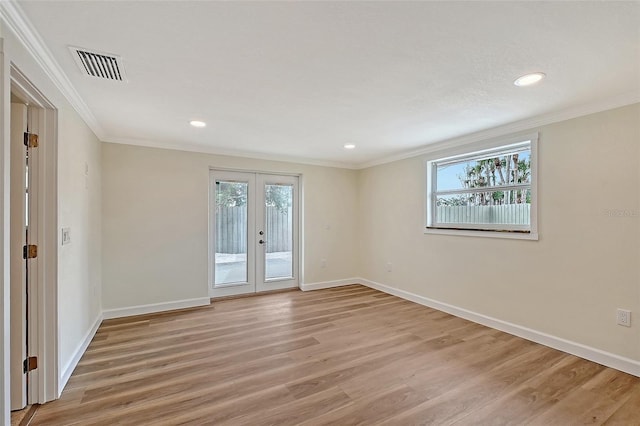 1203 Lyric Ln, Sarasota, FL 34242 - empty room featuring french doors, light wood-type flooring, ornamental molding, and recessed lighting