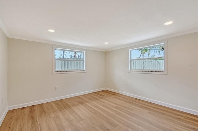 1203 Lyric Ln, Sarasota, FL 34242 - empty room with ornamental molding, light wood-style floors, and recessed lighting
