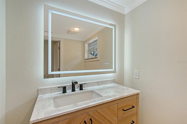 1203 Lyric Ln, Sarasota, FL 34242 - bathroom with ornamental molding, a textured wall, and vanity