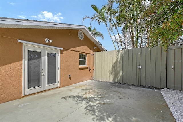 1203 Lyric Ln, Sarasota, FL 34242 - view of patio / terrace featuring french doors