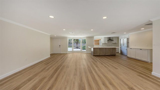 1203 Lyric Ln, Sarasota, FL 34242 - unfurnished living room with recessed lighting, ornamental molding, and light wood-type flooring
