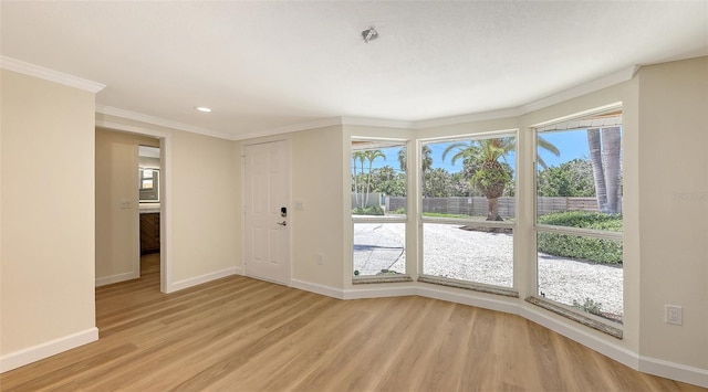 1203 Lyric Ln, Sarasota, FL 34242 - foyer with light wood-type flooring, recessed lighting, and crown molding
