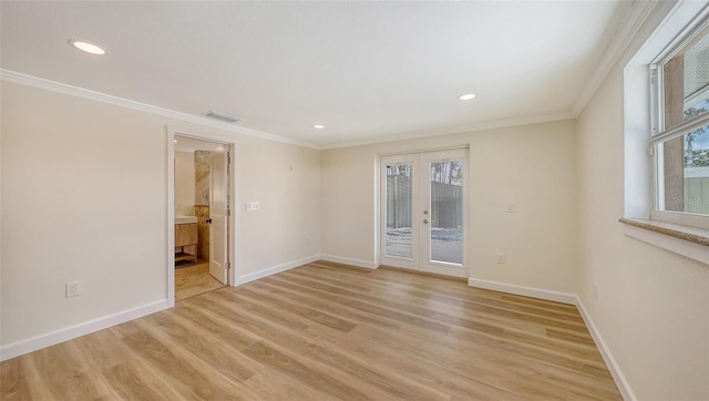 1203 Lyric Ln, Sarasota, FL 34242 - spare room with french doors, plenty of natural light, ornamental molding, light wood-type flooring, and recessed lighting