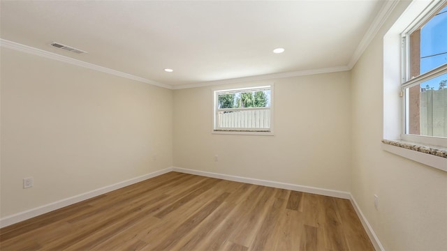 1203 Lyric Ln, Sarasota, FL 34242 - unfurnished room with light wood finished floors, crown molding, and recessed lighting