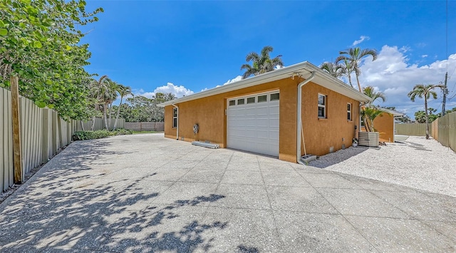 1203 Lyric Ln, Sarasota, FL 34242 - garage featuring concrete driveway