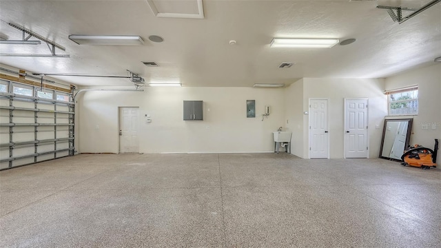 1203 Lyric Ln, Sarasota, FL 34242 - garage with electric panel and a garage door opener