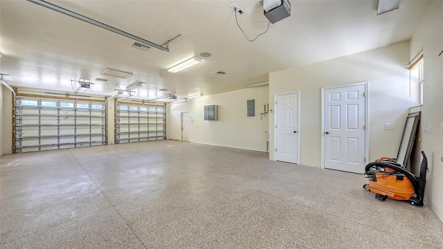 1203 Lyric Ln, Sarasota, FL 34242 - garage featuring electric panel and a garage door opener
