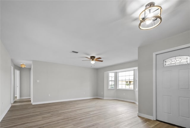 222 Caddy Rd, Rotonda West, FL 33947 - entryway with a ceiling fan and light wood-style floors