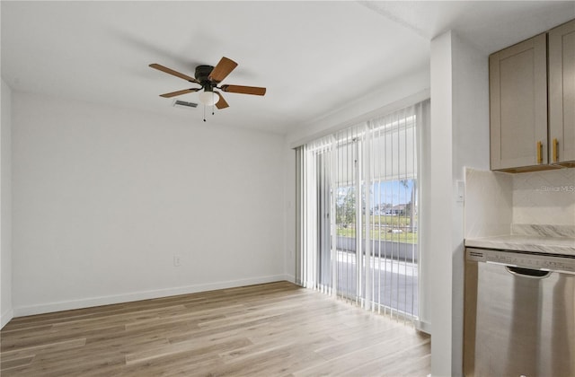 222 Caddy Rd, Rotonda West, FL 33947 - unfurnished dining area featuring a ceiling fan and light wood-type flooring