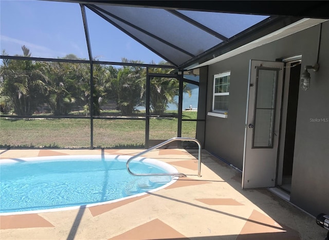 222 Caddy Rd, Rotonda West, FL 33947 - outdoor pool featuring glass enclosure, a patio area, and a yard