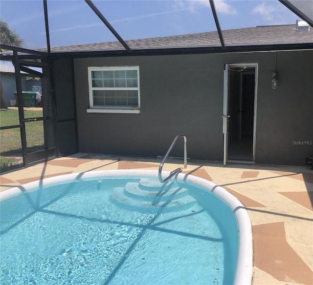 222 Caddy Rd, Rotonda West, FL 33947 - outdoor pool featuring glass enclosure and a patio