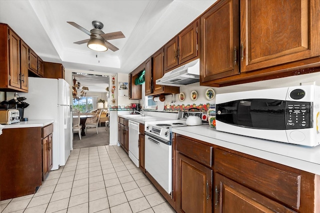 5600 Beach Way Dr Unit 201, Sarasota, FL 34242 - kitchen featuring white appliances, under cabinet range hood, ceiling fan, and light countertops
