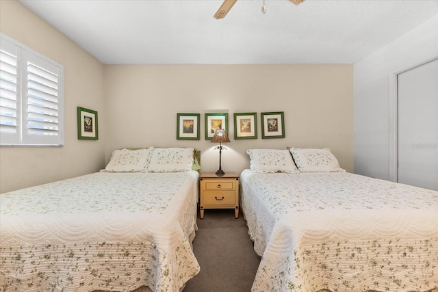 5600 Beach Way Dr Unit 201, Sarasota, FL 34242 - carpeted bedroom with a ceiling fan