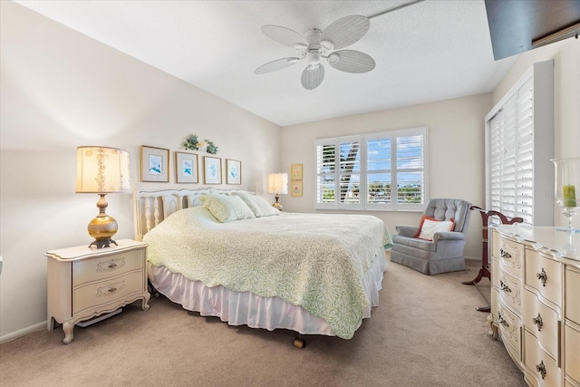 5600 Beach Way Dr Unit 201, Sarasota, FL 34242 - bedroom featuring light colored carpet, a ceiling fan, and baseboards