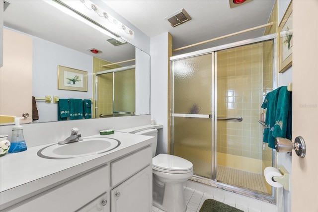 5600 Beach Way Dr Unit 201, Sarasota, FL 34242 - bathroom featuring toilet, vanity, tile patterned floors, and a stall shower