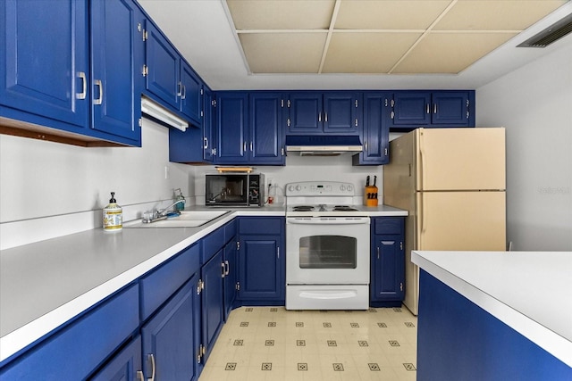 5600 Beach Way Dr Unit 201, Sarasota, FL 34242 - kitchen featuring white appliances, under cabinet range hood, a sink, light countertops, and blue cabinetry