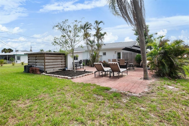 404 Bayshore Rd, Nokomis, FL 34275 - back of house with a patio and a yard