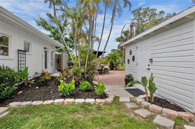 404 Bayshore Rd, Nokomis, FL 34275 - view of yard featuring a wooden deck and outdoor dining space
